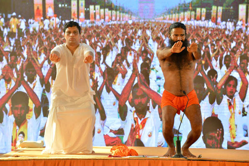 Swami Ramdev, Achariya Balakrishna perform Yoga with followers at Haridwar