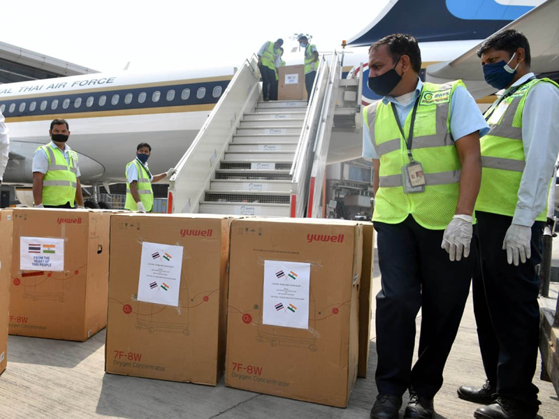 Workers loading emergency medical supplies from Thailand