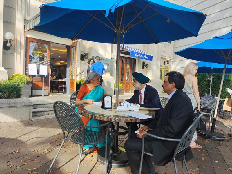 Nirmala Sitharaman with ambassador Taranjit Singh Sandhu walking through the streets of Washington DC