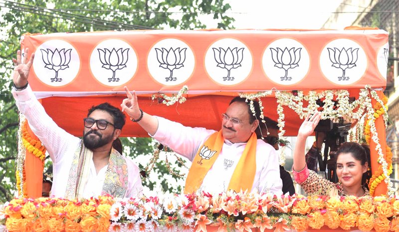 J P Nadda waving supporters during road show for Babul Supriyo in Kolkata