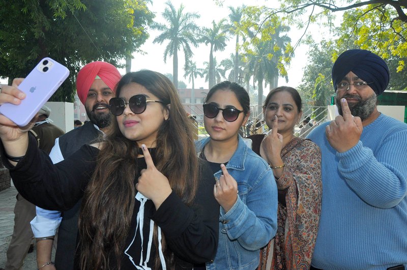 Punjab polls: People wait in queue to cast their votes