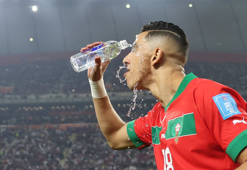 Achraf Dari of Morocco celebrates his goal with teammates during third place play-off match