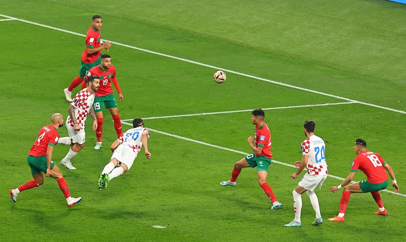 Achraf Dari of Morocco celebrates his goal with teammates during third place play-off match