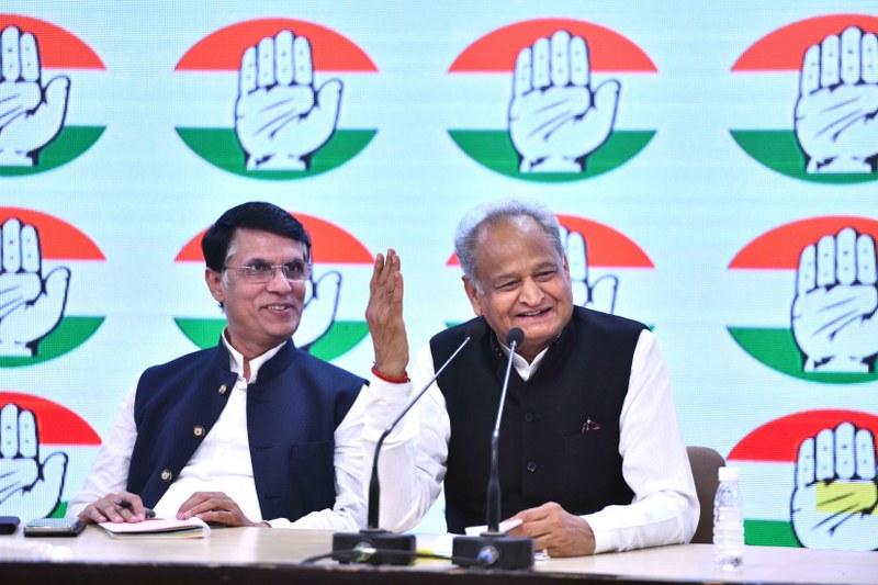 Rajasthan CM Ashok Gehlot addresses a press conference with Cong leader Pawan Khera