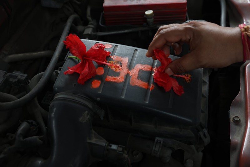 Priest offers prayers to taxi during Vishwakarma Puja in Kolkata