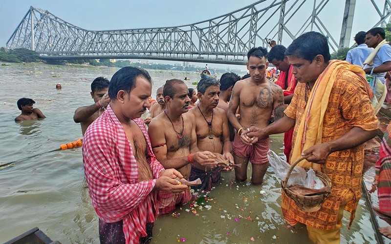 In Images: Kolkata Marks Mahalaya with Hooghly Tarpan and Durga's Chokkhudan