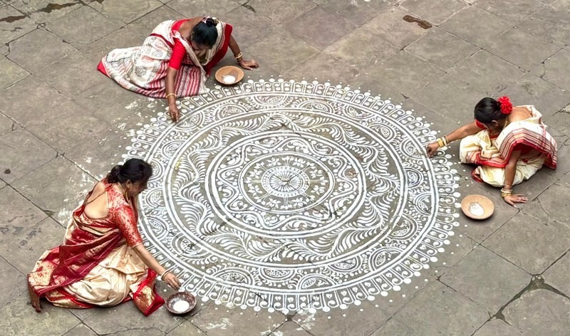 In Images: Women in Kolkata create alpana to celebrate Laxmi Puja