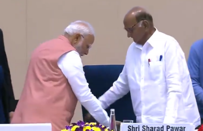PM Modi helps Sharad Pawar to get seated at a programme, offers him water