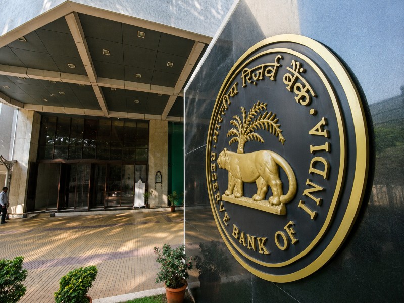 Market experts assess RBI's policy pause amid inflation risks and foreign investment measures.