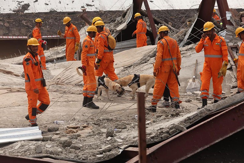 In Images: NDRF, Army intensify search as more bodies recovered from Taratala godown collapse site