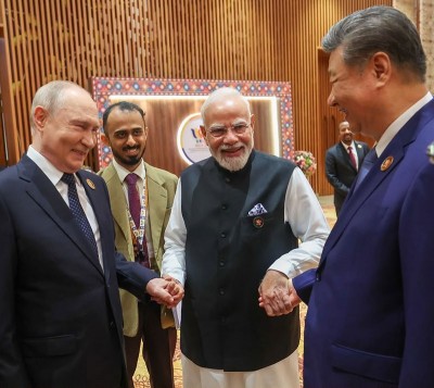 Modi holds Xi Jinping, Putin’s hands at BRICS Summit, shares image