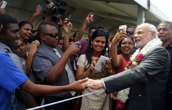 Modi being received on his arrival, at Nausori International Airport