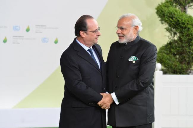 Narendra Modi being received by the President of France