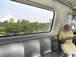 Narendra Modi travelling by the Delhi Metro