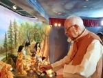  Governor of West Bengal Shri Keshari Nath Tripathi is offering an arati to the Durga idol