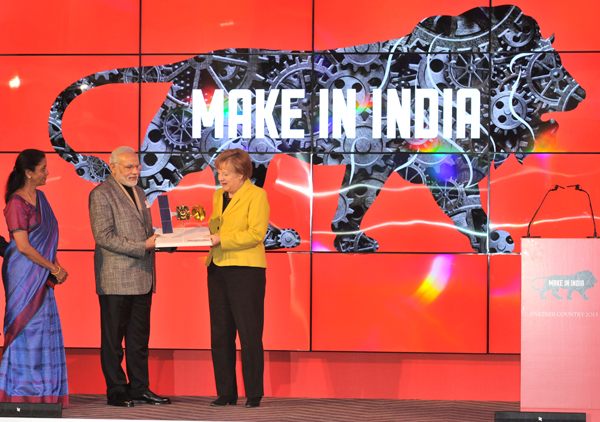 Modi and the German Chancellor, Ms. Angela Merkel at the Joint Inauguration of the India Pavilion and the Joint Walk-About Make in India