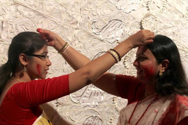 Women smear each other with sindoor on Vijaya Dasami