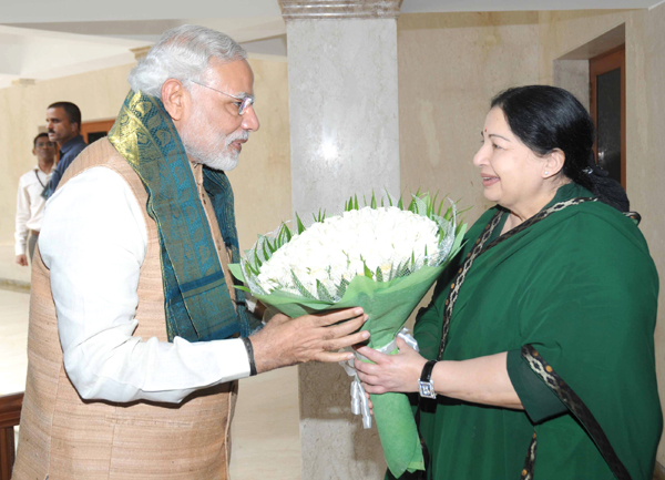 Narendra Modi being received by the Governor of Tamil Nadu