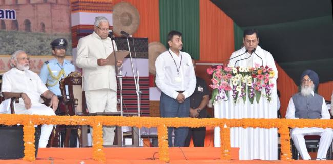 Narendra Modi being received by the Governor of Assam