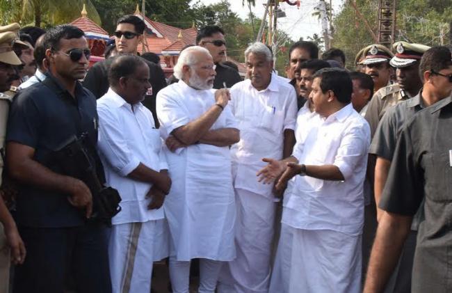 Narendra Modi being received by the Governor of Kerala