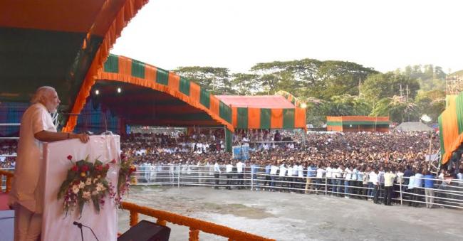 Narendra Modi being received by the Governor of Assam