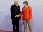 Narendra Modi being welcomed by the German Chancellor
