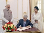 Wickremesinghe signing the visitorsâ€™ book, at Hyderabad House, in New Delhi