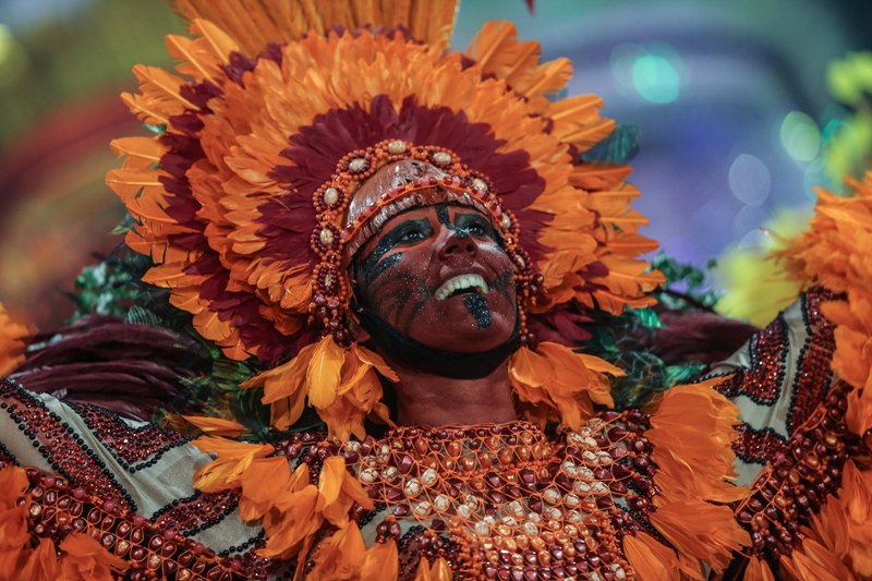 Samba school reveler performs in carnival parade