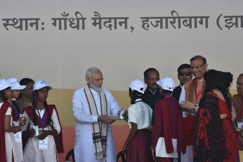 PM Modi provides milk packets to schoolchildren
