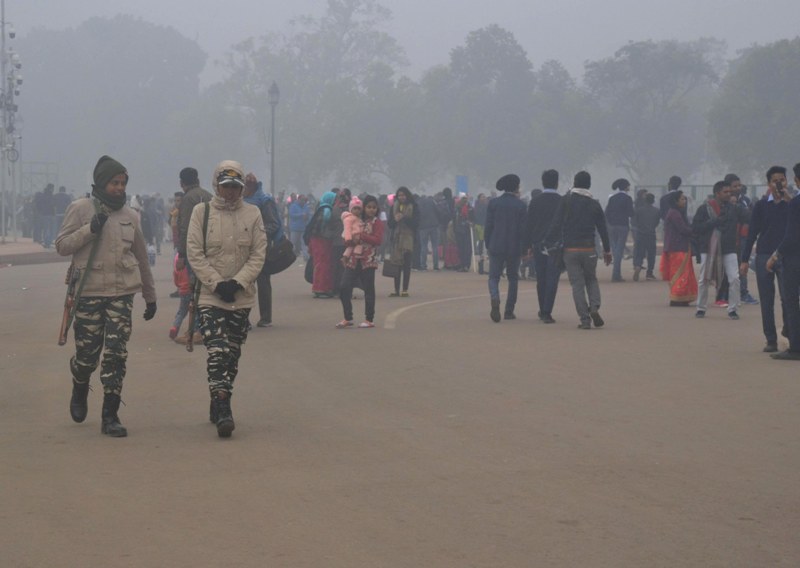 Visitors wrap themselves in warm clothes in New Delhi