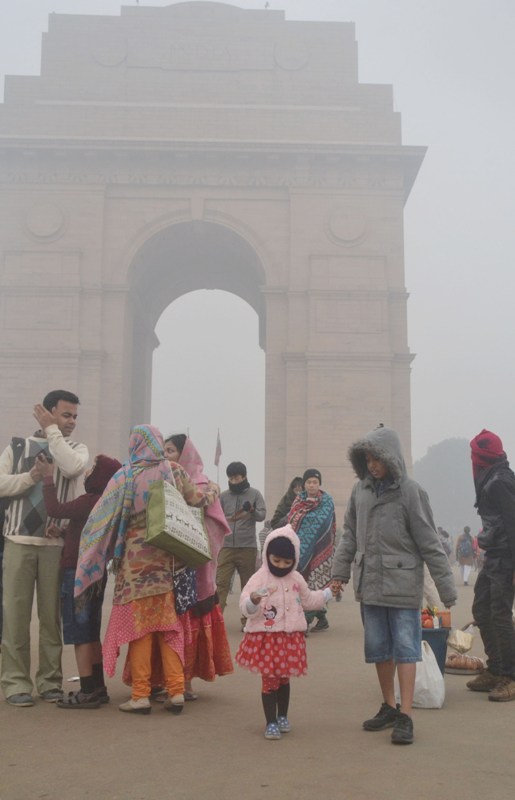 Visitors wrap themselves in warm clothes in New Delhi