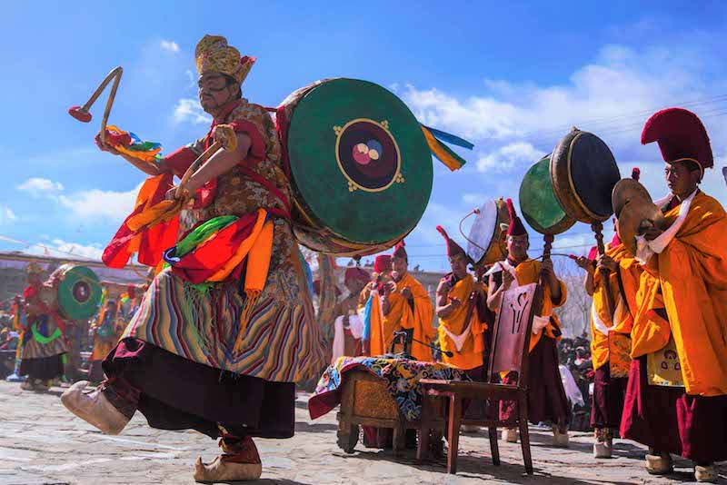 Buddhist monks perform Cham dance in Tibet