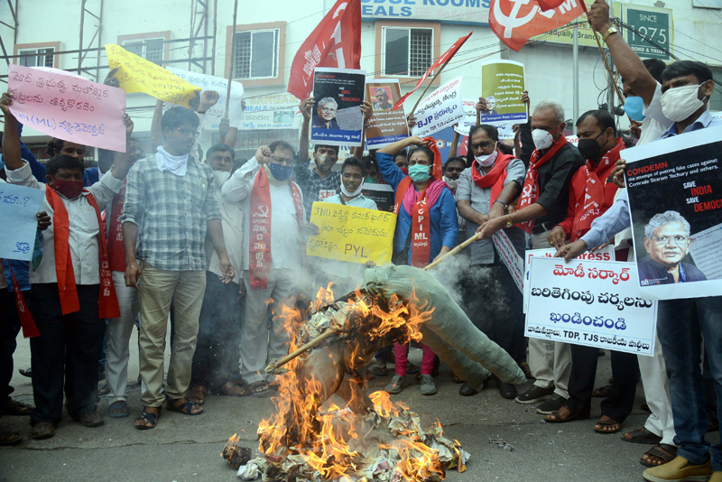 CPI(M) activists protesting against the naming of against Sitaram Yechury and others in Delhi riots