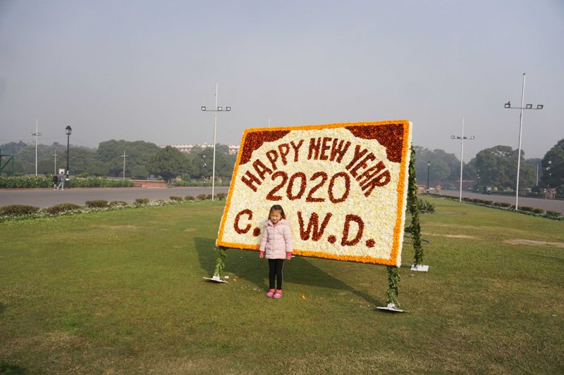 Tourists pose for photograph in New Delhi