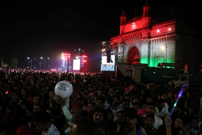 People enjoy light show during New Year celebration in Mumbai