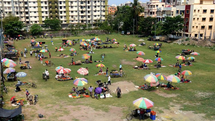People maintain social distancing at Kolkata market during lockdown