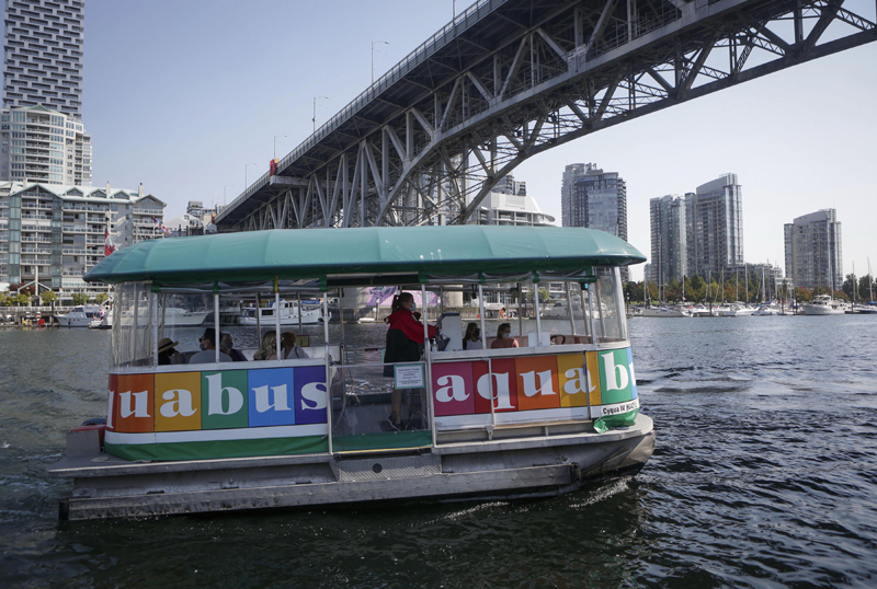 Aquabus ferry carries a few tourists on board in Vancouver