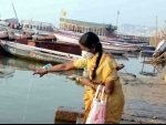 Woman offers obeisance to Ganges in locked down Varanasi