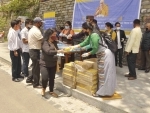 Shimla: Dalai Lama followers distribute masks, sanitizers and juice