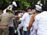 Police detain Aam Admi Party (AAP) workers during protest against the NEET- JEE examination