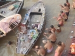 People performing Tarpan rituals during Pitra Paksha at river Ganga in Varanasi