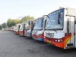 Commuters on their way to board the buses during Bharat Bandh in Vijayawada