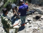 Police and Civil Defence team members retrieving body of a boy died in Ramban accident