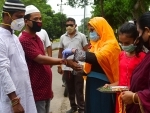 Muslim girls tying Rakhi