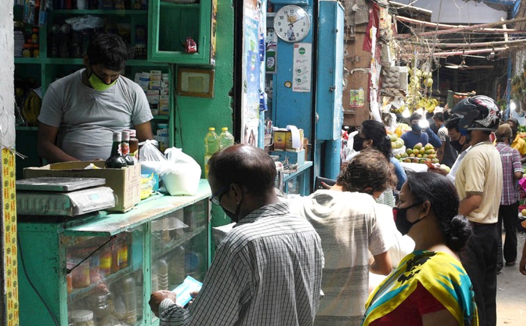People queue up in front of pharmacies in Kolkata