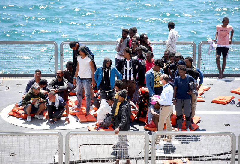 Migrants arrive at the Boiler Wharf in Senglea