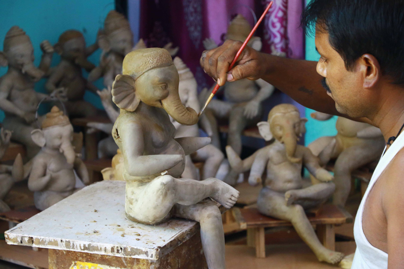 Artisans make Ganesha idol ahead of Ganesh Chaturthi