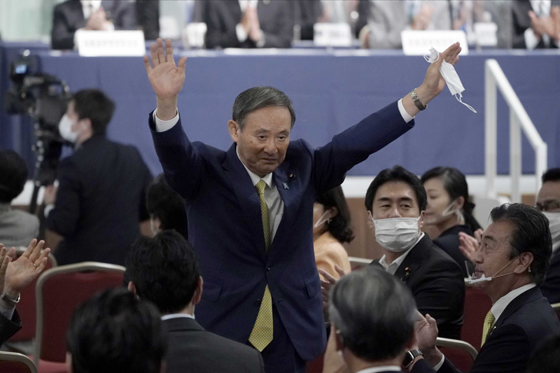 Japans Chief Cabinet Secretary Yoshihide Suga acknowledges his election as new President