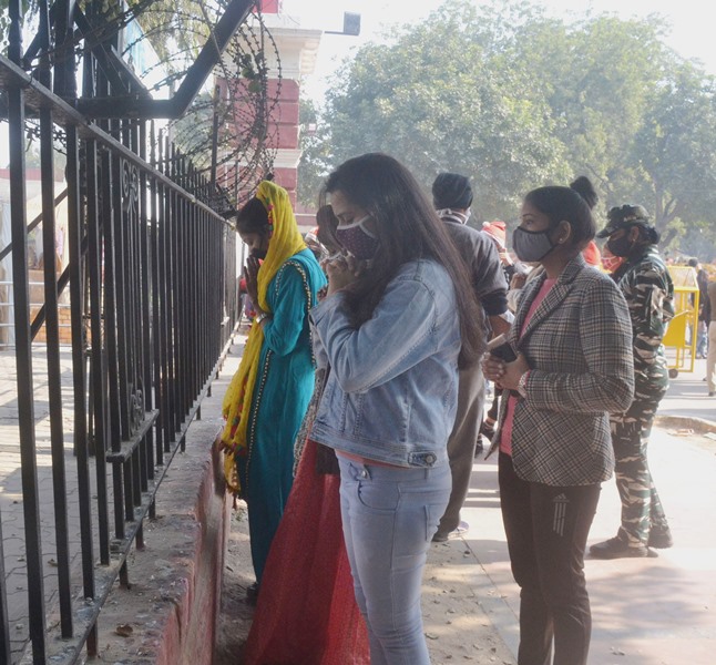New Delhi: Christian devotees lighting the candles outside Sacred Heart Cathedral Church