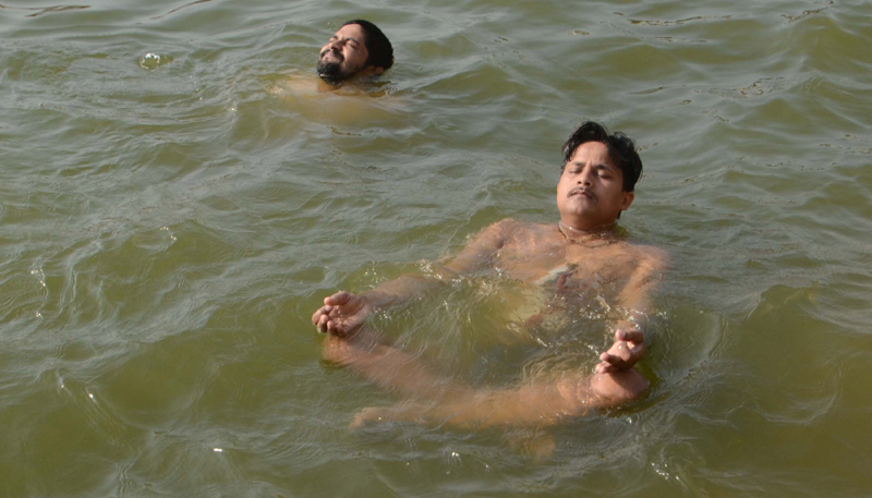 Varanasi: People practise Yoga on Ganges ghat